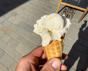 ice cream cone on a hand