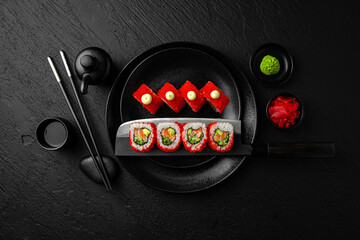 California salmon roll. Sushi composition on black background. The Art of Japanese Cuisine. Food...