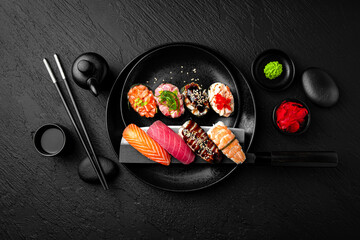 Nigiri composition on black background. The Art of Japanese Cuisine. Food photography for menu and...