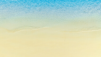 Top view nature of the beach and sea Summer with sunshine, sandy beaches, clear blue waters sparkling against the blue sky. on island with good ecology and environment Background for summer vacation