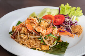 Pad Thai (Stir-fried rice noodles with shrimp) flavor with sugar, lime, ground dried chilies and peanuts; Thailand's popular dishes.