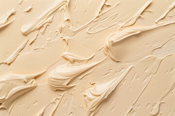 Abstract background with different shades of cream texture on beige surface