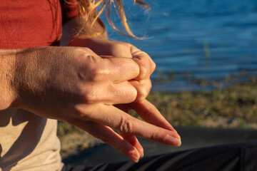 Hand Gesture in Meditation by the Lake