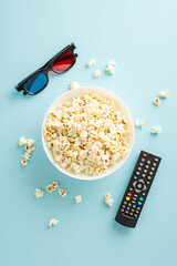 Immerse in premieres via TV app at home. Vertical top view of popcorn, 3D glasses, remote for...