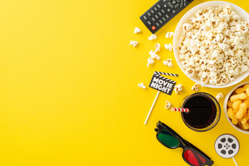 Cozy cinema experience at home with snacks and essentials for movie night. Top view yellow background adorned with movie-themed decor. Ideal for intimate gathering. Empty space for text or advertising