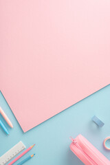 Creative vertical flat lay photo of a workspace with pastel pink and blue hues, school supplies,...
