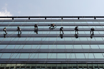 Professional window cleaning working in tower business center