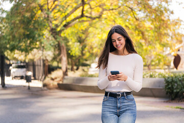 caucasian woman smiling happy using mobile phone