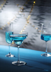 Glasses with blue alcohol cocktail ready for a party