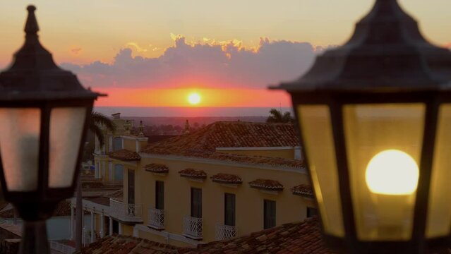 Sunset, Caribbean in a tropical climate. View from observation deck terrace of a beautiful sunset in Caribbean city of Trinidad, on island of Cuba, overlooking the ocean. Sunset Calm Tranquility Scene