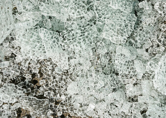 Background of broken tempered glass into small pieces.