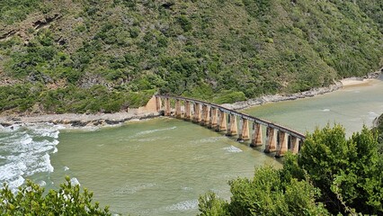 Fototapeta premium Bridge Over River Near Mountain