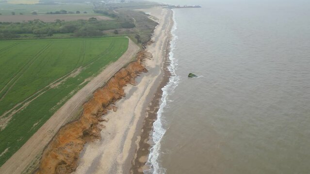 Pan shot of an empty Kessingland Beach in Suffolk, England. Drone view.