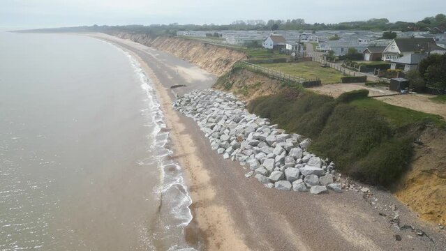 Aerial parallax view of Pakefield Beach during daytime in England. Drone view.