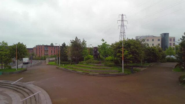 Aerial shot over CS Lewis Square in East Belfast, Northern Ireland.

The camera moves backwards, revealing a statue of Aslan the Lion in the square.

Produced in 4K, 60fps and in Rec709 color space.