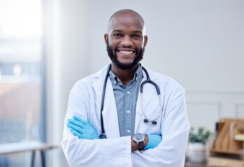 Black man, doctor and portrait with smile in office with confidence for job in medical field with happiness. Healthcare expert, professional and stethoscope with pride in help for people with health