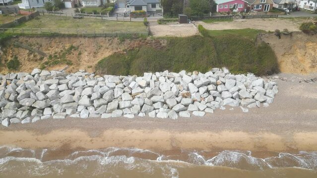 Drone view of stones kept at shore of Pakefield Beach in Lowestoft, England.