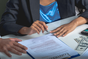 businessman and woman sign contract by pen on paper agreement in office. Financial loan lawyers...