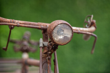 Old decay bicycle on green vine climbing garden wall outdoor. Rust Classic bike old bicycle on...