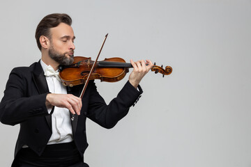 Bearded musician performed violin at classical music concert
