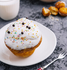 Fresh baked cupcake with sprinkles and milk