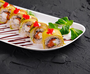 Gourmet sushi roll with salmon and roe