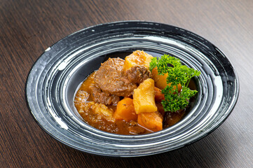 A close-up image of a piece of toast with whipped cream and brown sugar crystals on top.