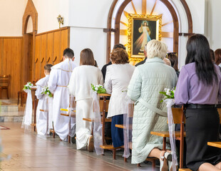 Shot of the people gathered for mass at Roman catholic church. Religion