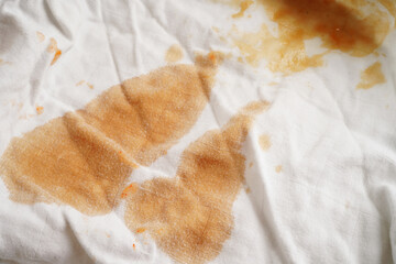 Dirty tomato sauce stain or ketchup on cloth to wash with washing powder, cleaning housework concept.