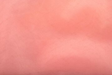 Peach color tulle fabric texture. Background, texture.