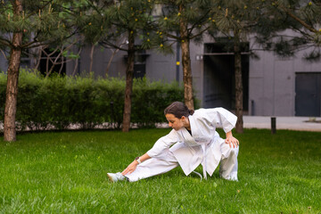 young girl in a white kimono, karate