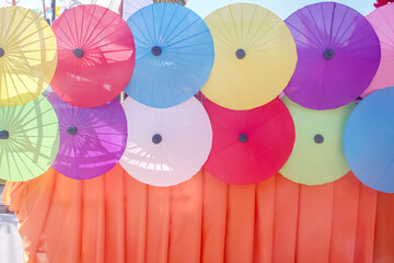 Decorative umbrella patterns with fabric wall on background