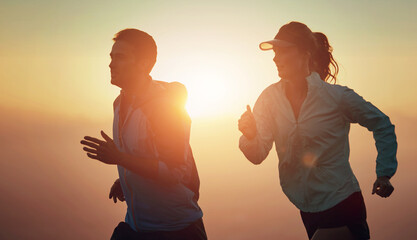 Sunrise, couple and running outdoor for race training, exercise and fitness with cardio for health....