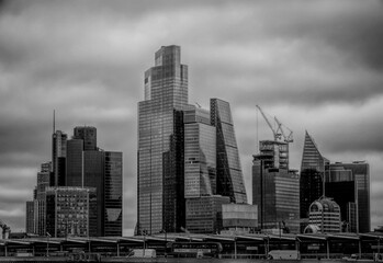 Grayscale of a city skyline on a cloudy day