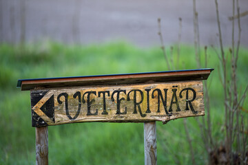 Stockholm, Sweden A wooden sign for a veterinary practice.