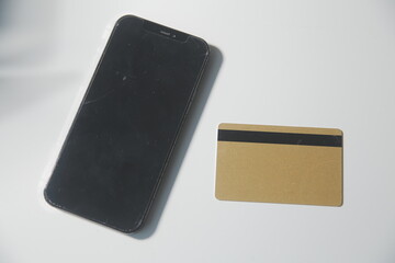 Calculator on a dark background, plastic cards and banknotes