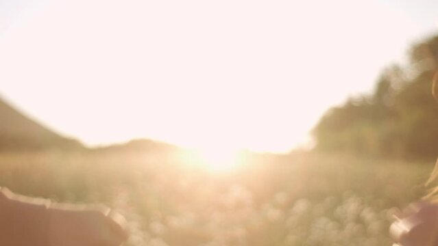 Teamwork concept. Close up of fist to fist commit solidarity respect gesture on background beautiful summer sunset. Lifestyle business team hands fists