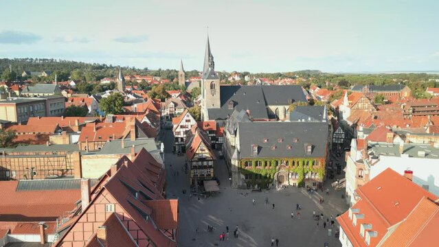Aerial view of Quedlinburg, town hall in the foreground in beautiful golden evening light, Saxony-Anhalt, Germany. High quality footage in 4k format
