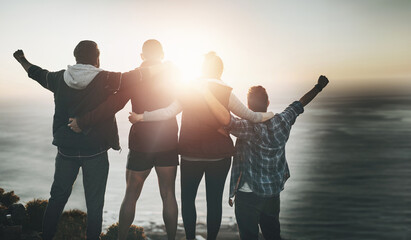Mountains, group and friends with hiking, celebration and excited with happiness, lens flare and...
