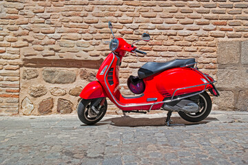 Red Vintage Scooter Parked on Street of Spain as one of The Most Popular Transport in Toledo