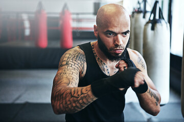 Fitness, punching and man in gym for exercise, boxing challenge or competition training. Power,...