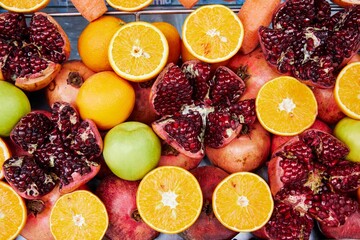 Vibrant display of fresh, assorted whole and cut fruits at a market