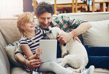 Happy, tablet and father with child and dog in home for watching movies, cartoons and online...