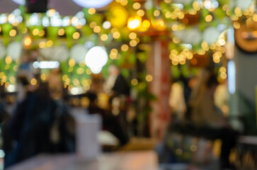 abstract blurred image of a street restaurant or cafe with light bokeh background