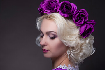 Beauty Concepts. Portrait of Blond Caucasian Female With Purple Flowery Crown