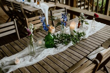 Elegantly set table ready for a special occasion, decorated with fresh vibrant flowers