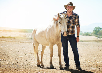 Portrait, farmer and man with horse, sunshine and nature with happiness, equestrian and smile....
