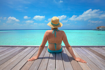 tourist in Maldives enjoying sea beach with turquoise water, vacation travel, woman in bikini and...