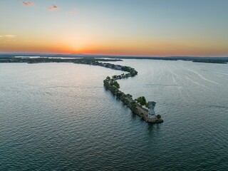 Idyllic scene of an island with a Horseshoe Bay Lighthouse on a tranquil body of water