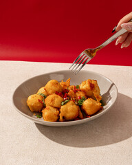 Salted chili tofu is a typical Indonesian food made from tofu which is fried and then given spicy chili seasoning